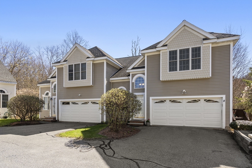 8 Brookside Lane, Unit 8 Northborough, MA 01532 - Photo 2 of 24 a front view of a house with a yard