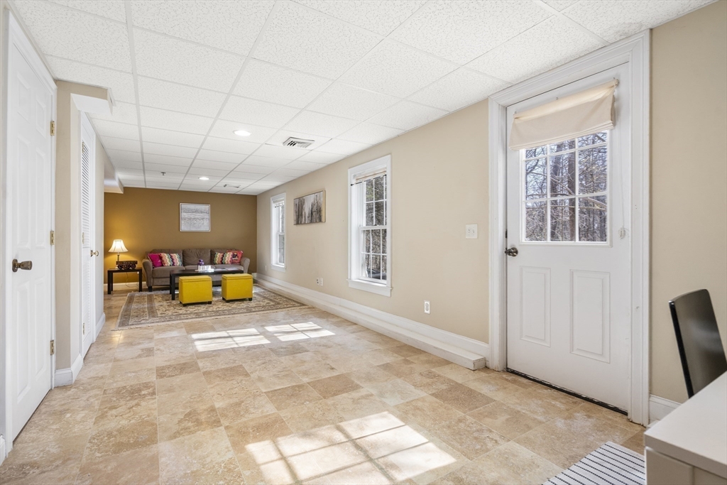 8 Brookside Lane, Unit 8 Northborough, MA 01532 - Photo 21 of 24 a view of a room with furniture and a window