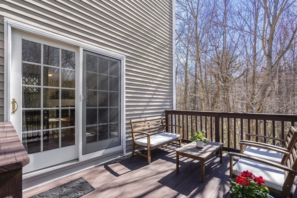 8 Brookside Lane, Unit 8 Northborough, MA 01532 - Photo 23 of 24 a view of a lounge chair in the balcony