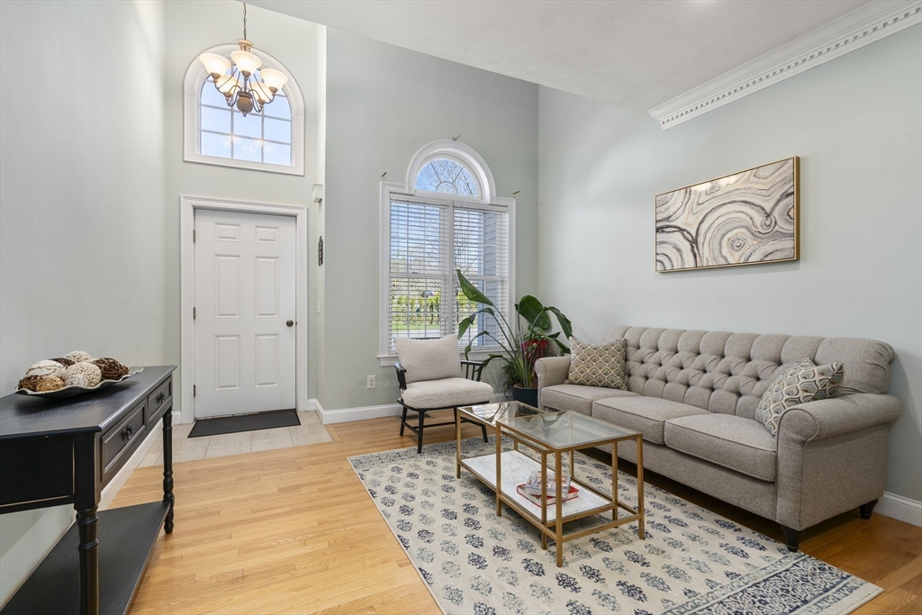 8 Brookside Lane, Unit 8 Northborough, MA 01532 - Photo 4 of 24 a living room with furniture and a window