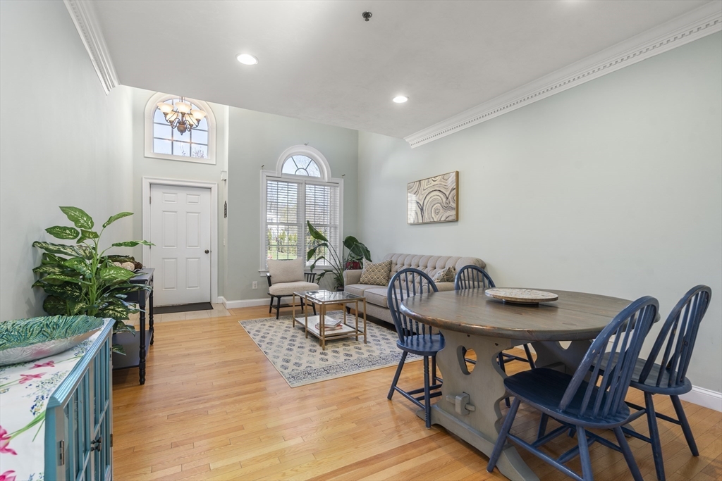 8 Brookside Lane, Unit 8 Northborough, MA 01532 - Photo 5 of 24 a view of a a dining room with furniture window and wooden floor
