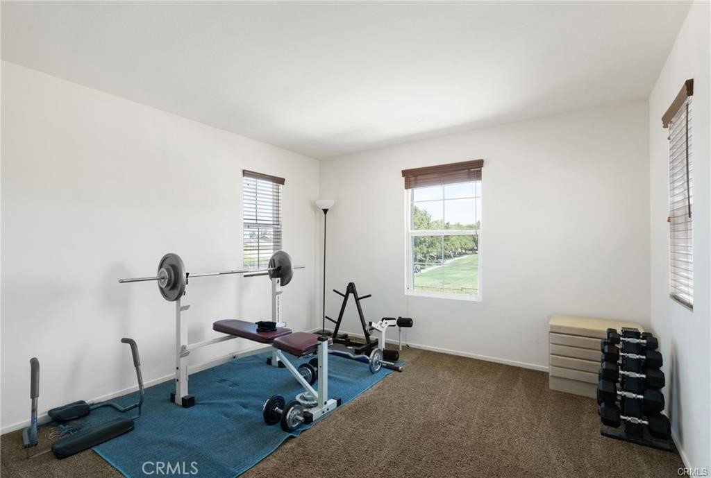 46545 Peach Tree Street Temecula, CA 92592 - Photo 12 of 30 a view of a workspace with furniture and a window