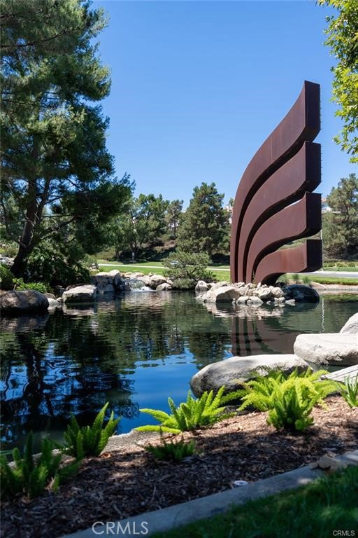 46545 Peach Tree Street Temecula, CA 92592 - Photo 25 of 30 a view of a lake with a house in background