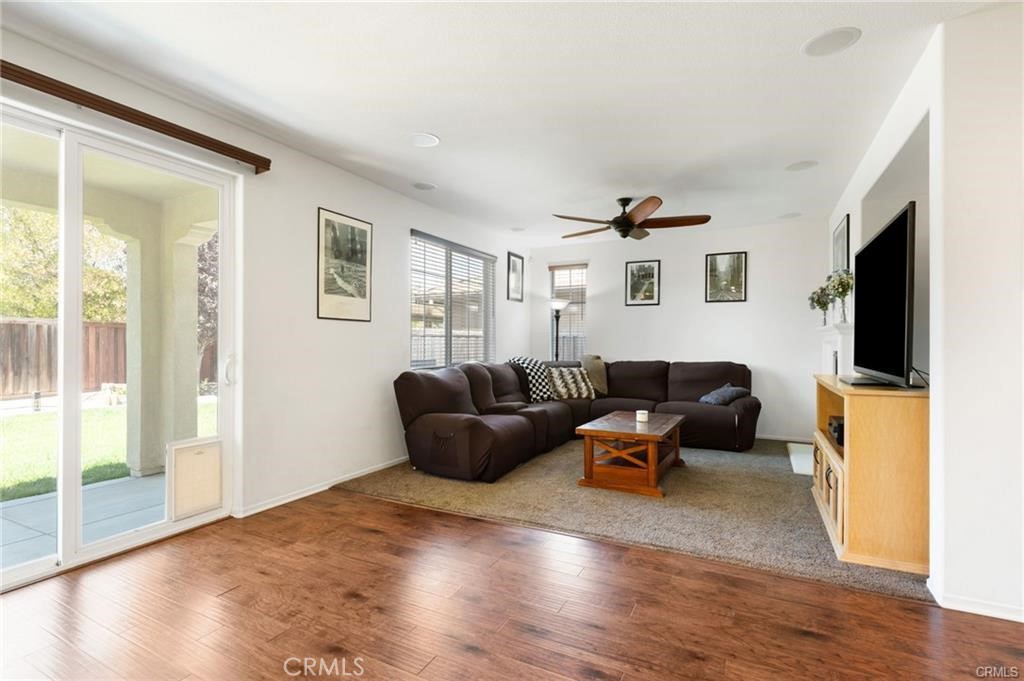 46545 Peach Tree Street Temecula, CA 92592 - Photo 6 of 30 a living room with furniture and a flat screen tv
