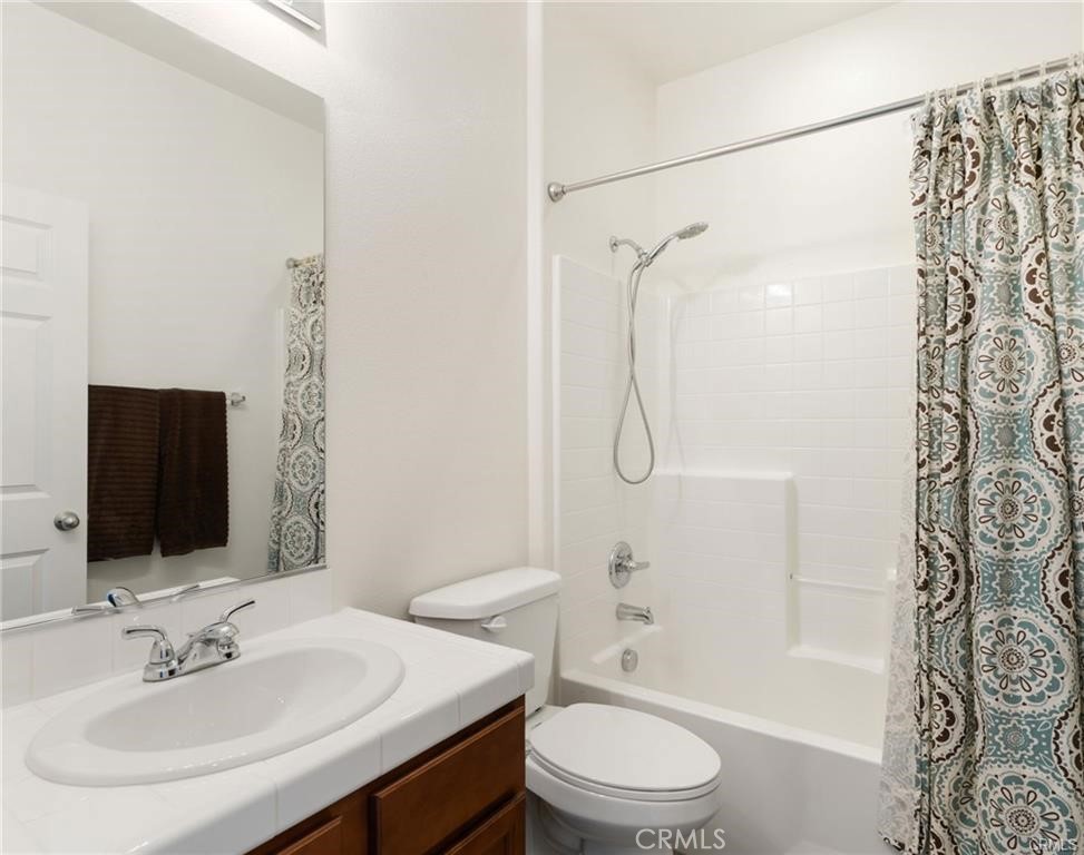 46545 Peach Tree Street Temecula, CA 92592 - Photo 8 of 30 a bathroom with a sink toilet and shower