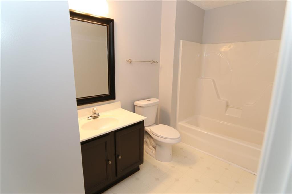 363 Springhaven Way Southeast Lawrenceville, GA 30046 - Photo 12 of 13 a bathroom with a sink a toilet and shower