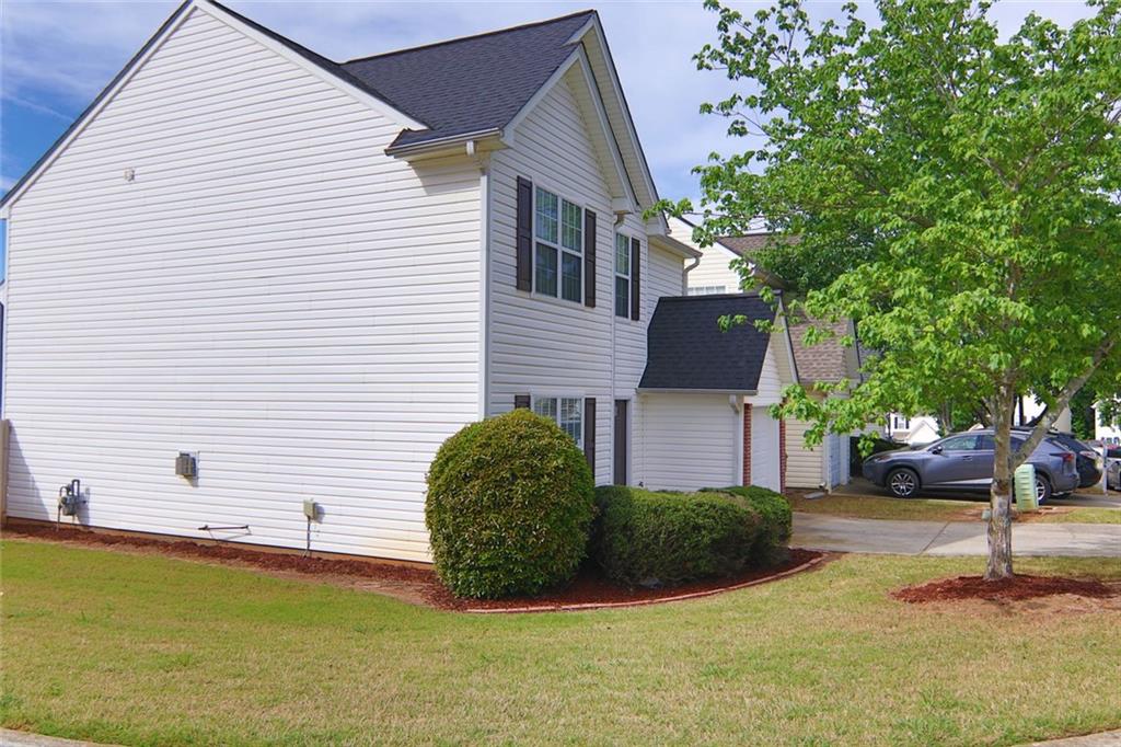363 Springhaven Way Southeast Lawrenceville, GA 30046 - Photo 2 of 13 a house view with a garden space
