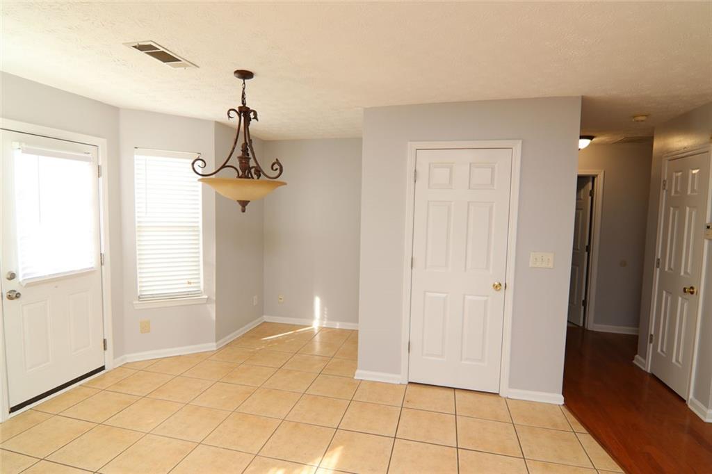 363 Springhaven Way Southeast Lawrenceville, GA 30046 - Photo 4 of 13 a view of empty room with window and chandelier
