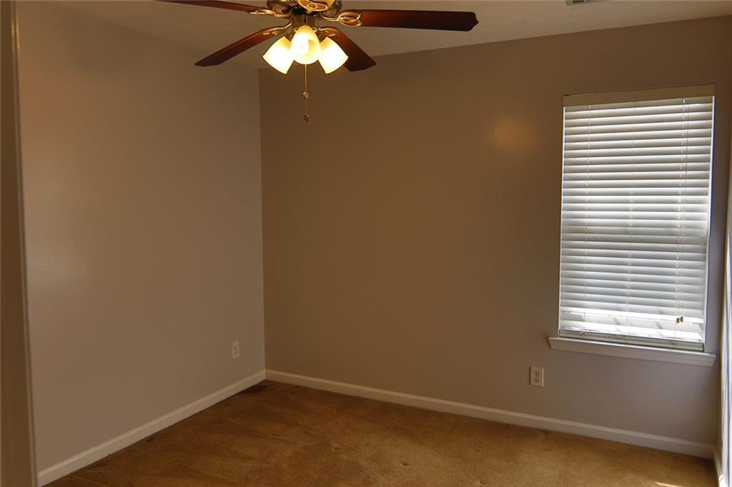 363 Springhaven Way Southeast Lawrenceville, GA 30046 - Photo 7 of 13 a view of a chandelier fan and a window