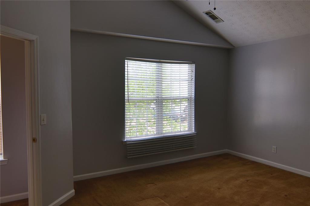 363 Springhaven Way Southeast Lawrenceville, GA 30046 - Photo 8 of 13 a view of an empty room with a window
