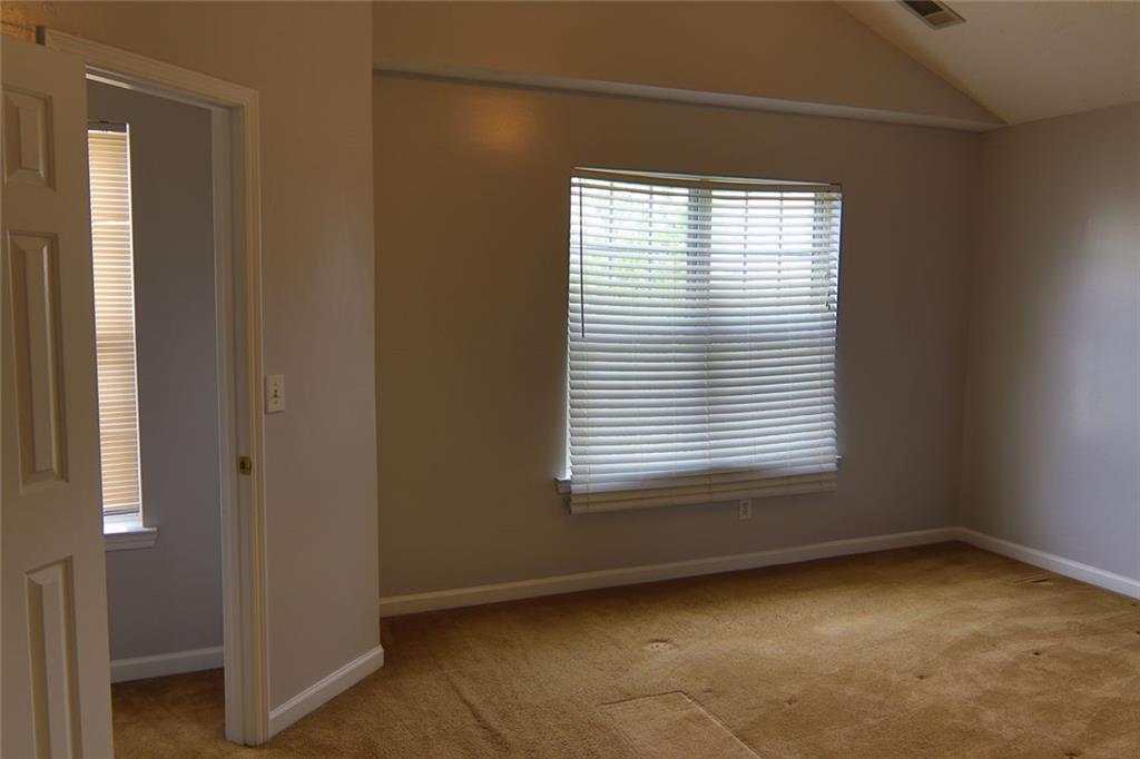 363 Springhaven Way Southeast Lawrenceville, GA 30046 - Photo 10 of 13 an empty room with a window
