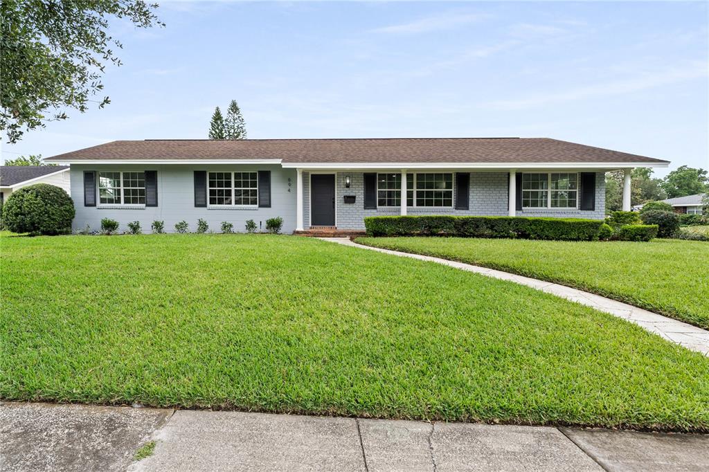 694 Dunblane Drive Winter Park, FL 32792 - Photo 1 of 1 a front view of a house with a garden