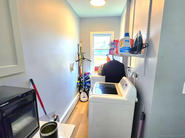 a view of living room with furniture and a window