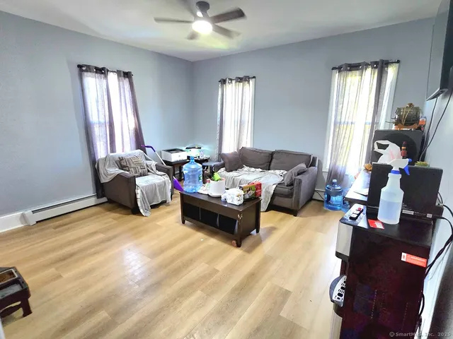 a living room with furniture and a window