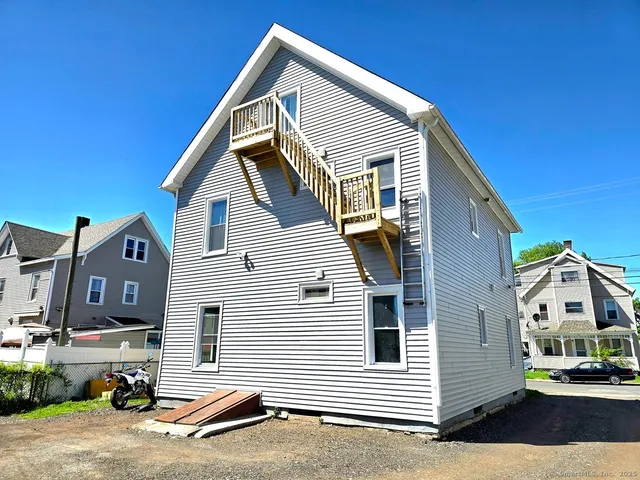 a view of a house with a street