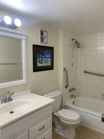 a bathroom with a sink a toilet and a bathtub