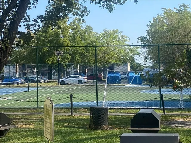 a view of a park with large trees