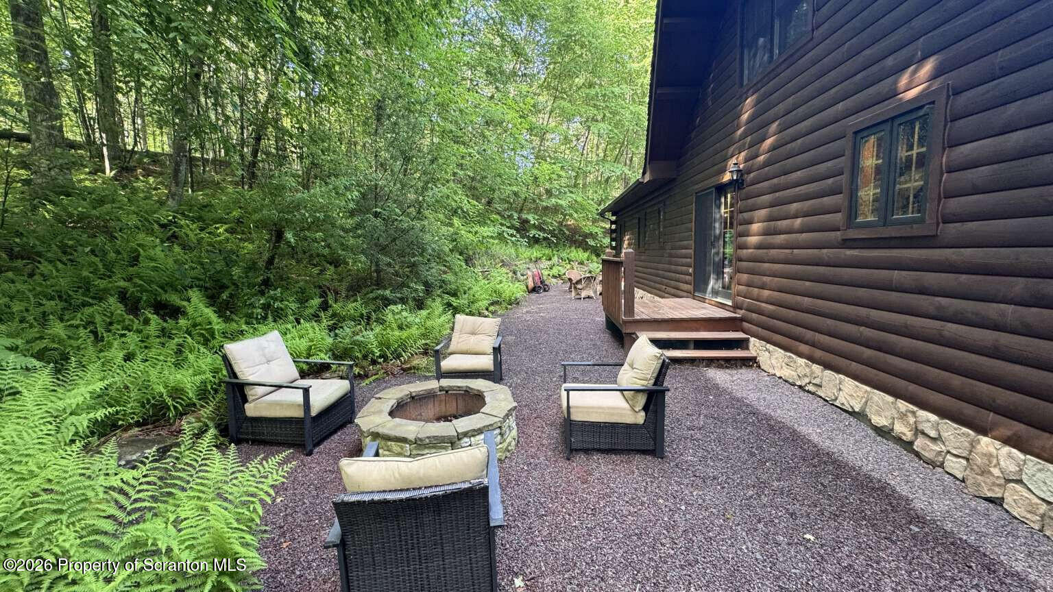 9 East Lake Road Moscow, PA 18444 - Photo 40 of 48 a view of a patio with chairs and a backyard