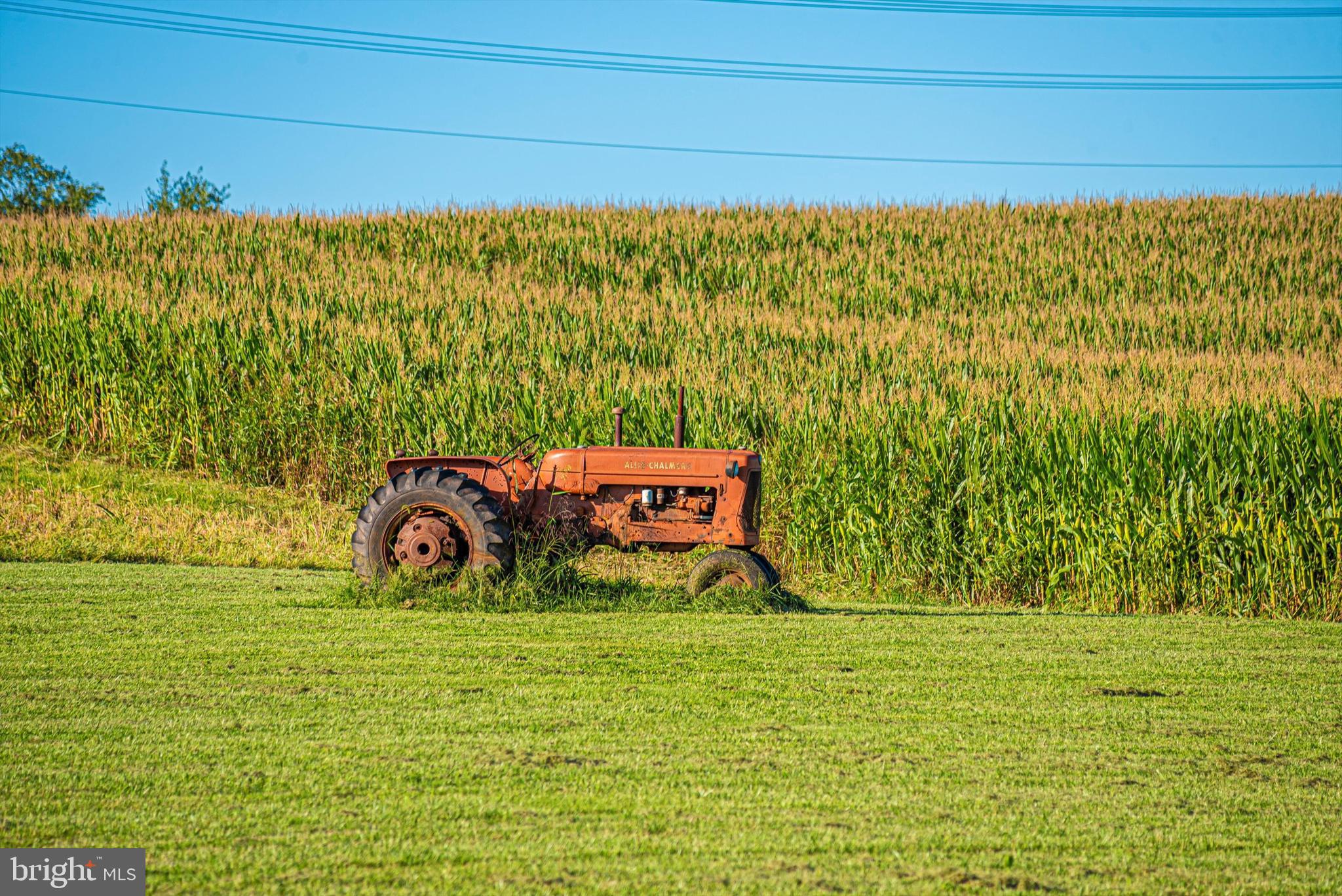 10330 Oak Hill Road Keymar, MD 21757 - Photo 75 of 99 That tractor does some serious work!