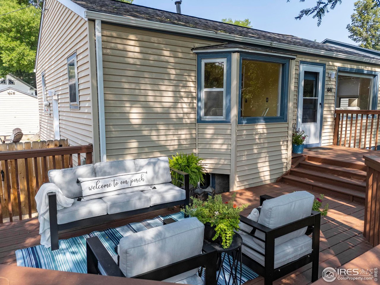 441 Sumner Street Longmont, CO 80501 - Photo 1 of 34 a view of a wooden chairs and table in the patio