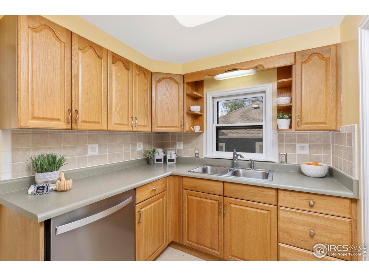 441 Sumner Street Longmont, CO 80501 - Photo 13 of 34 a kitchen with a sink cabinets and window