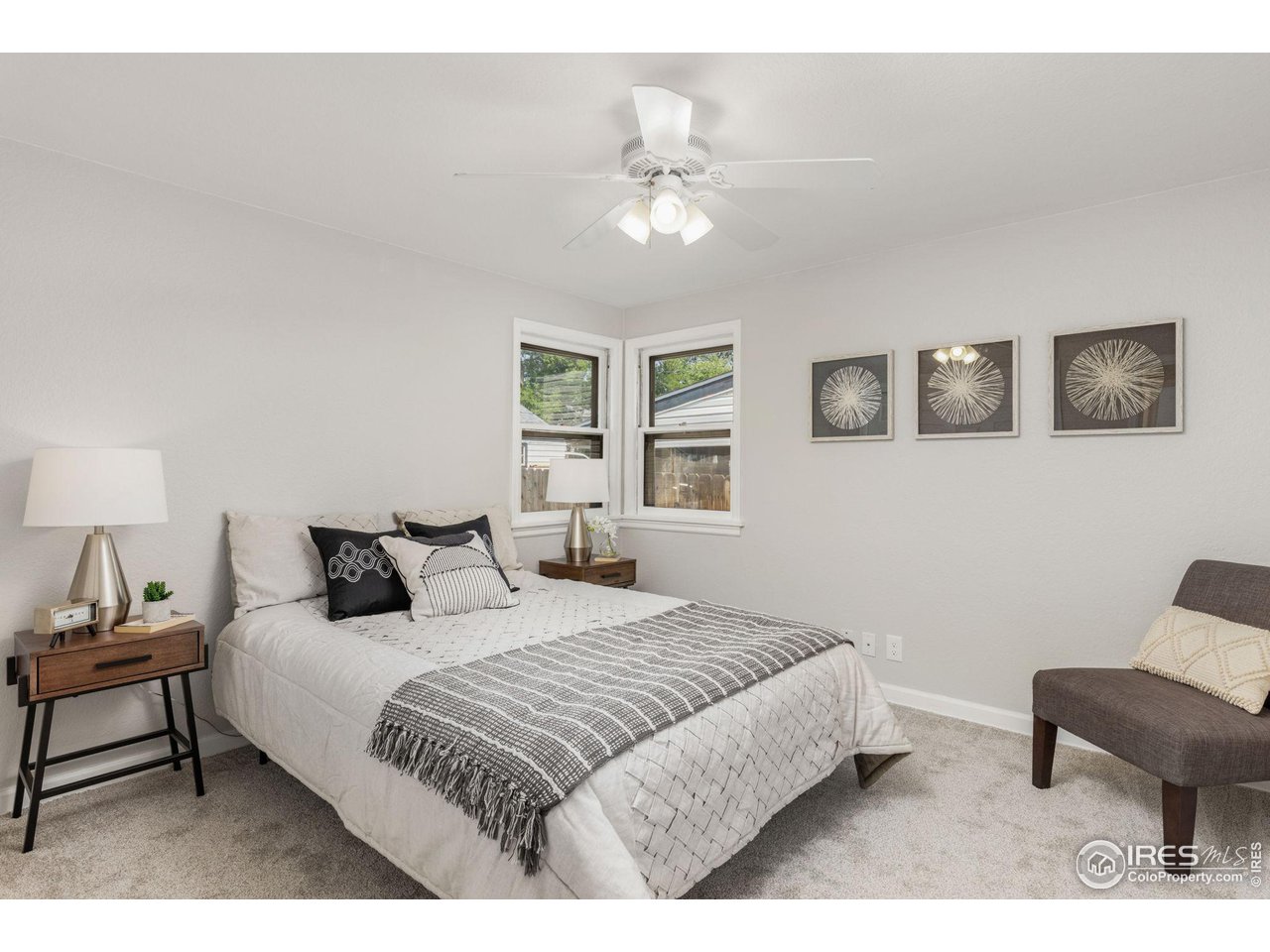 441 Sumner Street Longmont, CO 80501 - Photo 15 of 34 a bedroom with a bed and chair