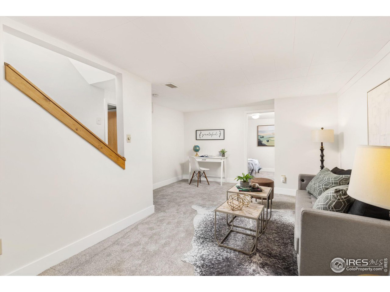 441 Sumner Street Longmont, CO 80501 - Photo 18 of 34 a living room with furniture and a window