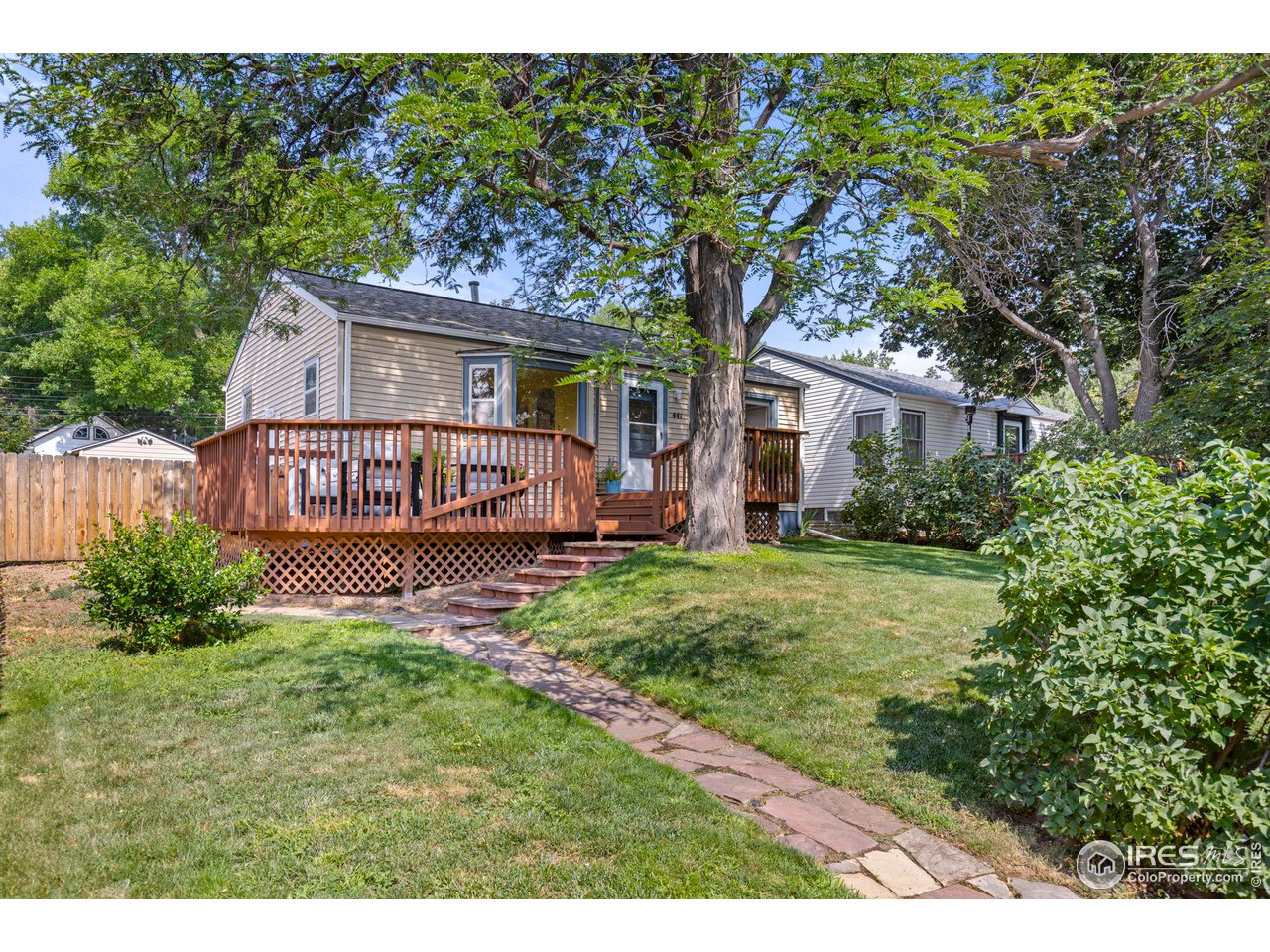 441 Sumner Street Longmont, CO 80501 - Photo 2 of 34 a view of a house with a yard and potted plants