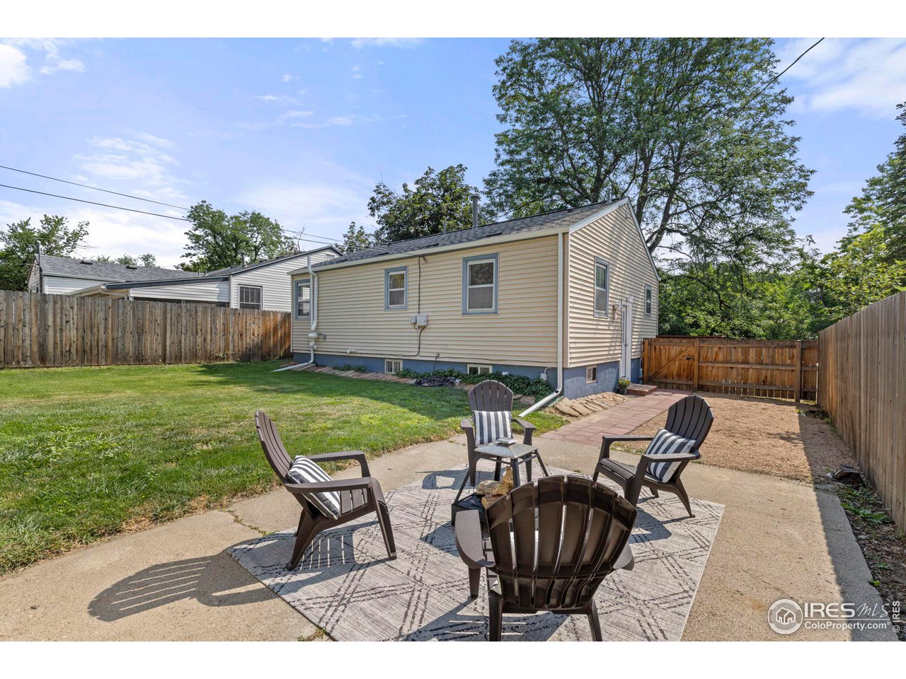 441 Sumner Street Longmont, CO 80501 - Photo 25 of 34 a view of backyard with seating space and trees