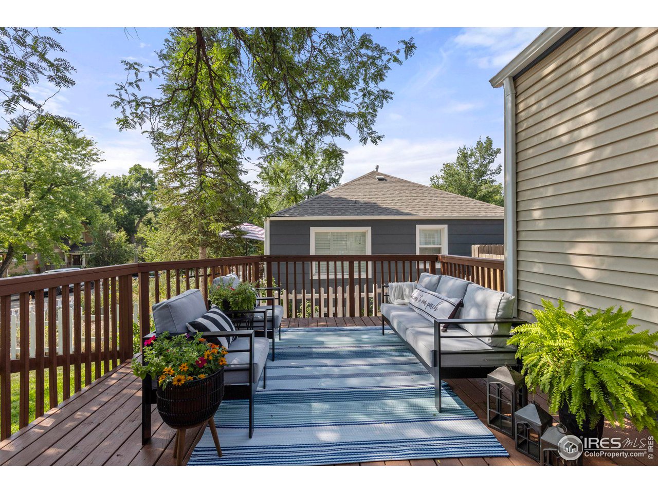 441 Sumner Street Longmont, CO 80501 - Photo 3 of 34 a view of a house with wooden deck