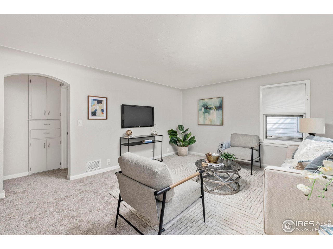 441 Sumner Street Longmont, CO 80501 - Photo 5 of 34 a living room with furniture and a flat screen tv
