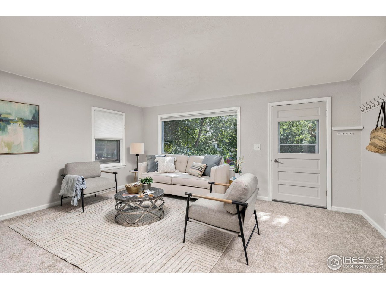 441 Sumner Street Longmont, CO 80501 - Photo 9 of 34 a living room with furniture a window and a table