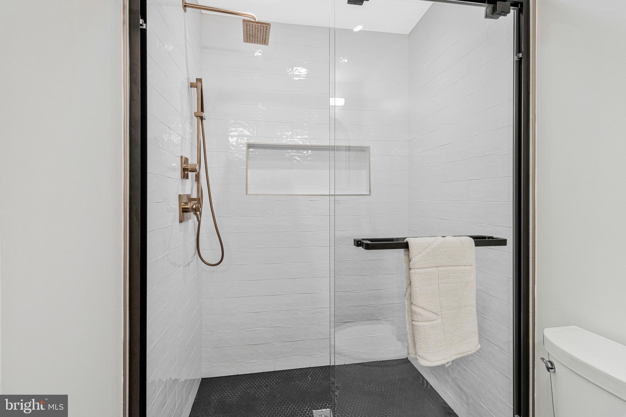 500 H Street Southwest Washington, DC 20024 - Photo 19 of 54 a bathroom with a glass shower door