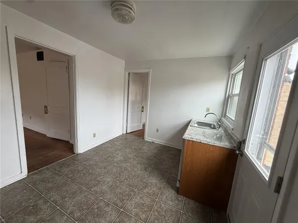 a kitchen with a stove and a refrigerator