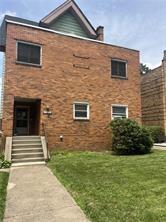 5839 Darlington Road, Unit 4 Pittsburgh, PA 15217 - Photo 2 of 21 a brick house with a yard