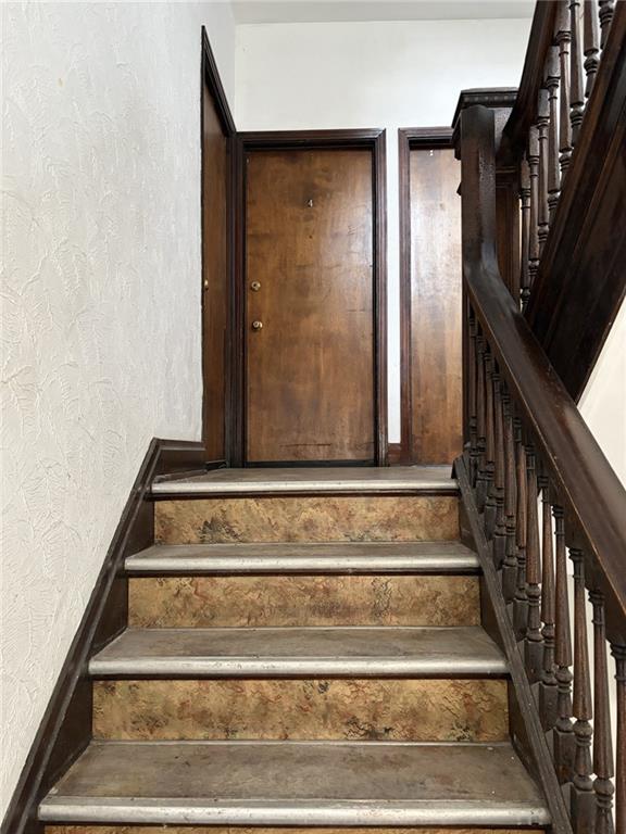 5839 Darlington Road, Unit 4 Pittsburgh, PA 15217 - Photo 3 of 21 a view of staircase with white walls and railing