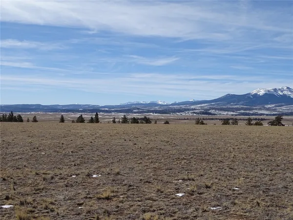a view of an ocean with a mountain