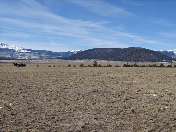 a view of an ocean and a mountain