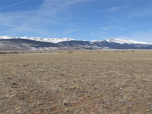 a view of an ocean beach and mountain