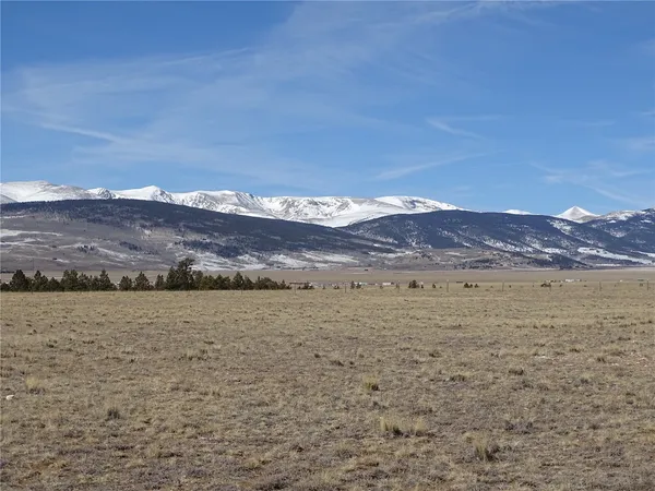 a view of an ocean beach and mountain