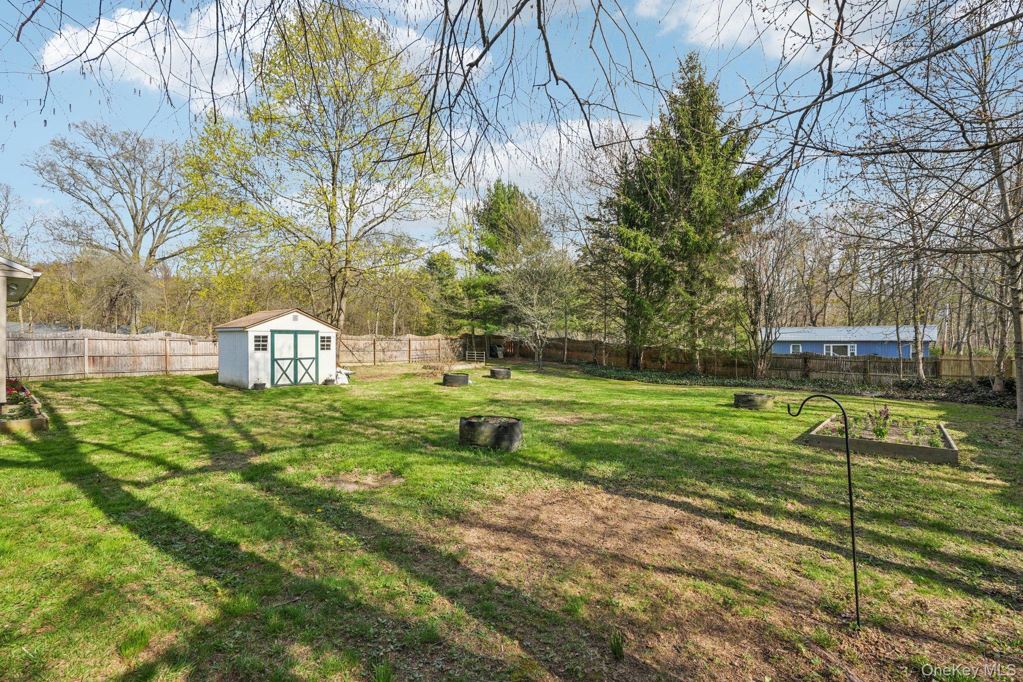 40 Widmer Road Wappingers Falls, NY 12590 - Photo 35 of 44 Fully fenced backyard with storage shed