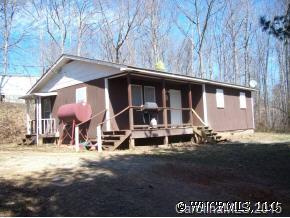 37 Roy Hollifield Road Marion, NC 28752 - Photo 1 of 7 a front view of a house with garden