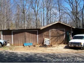 37 Roy Hollifield Road Marion, NC 28752 - Photo 5 of 7 a house with trees in the background