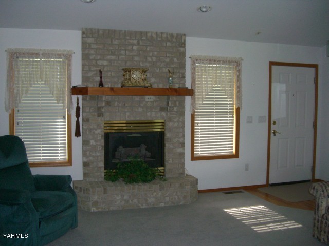 3303 Wiley Road Yakima, WA 98903 - Photo 3 of 9 a living room with furniture and a fireplace