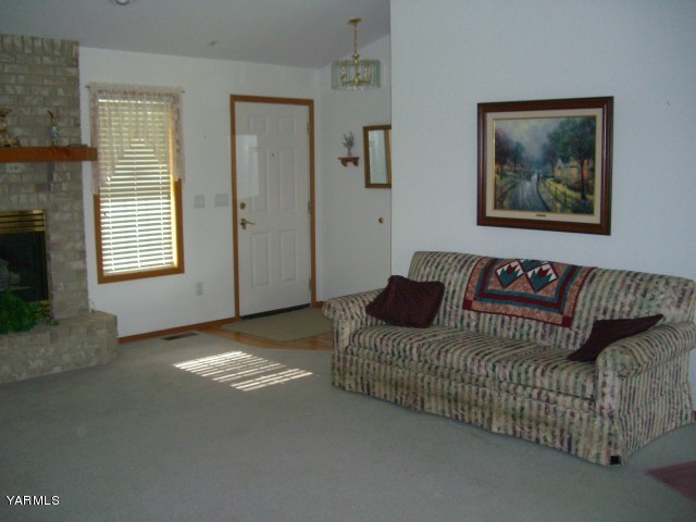 3303 Wiley Road Yakima, WA 98903 - Photo 4 of 9 a living room with furniture and a fireplace