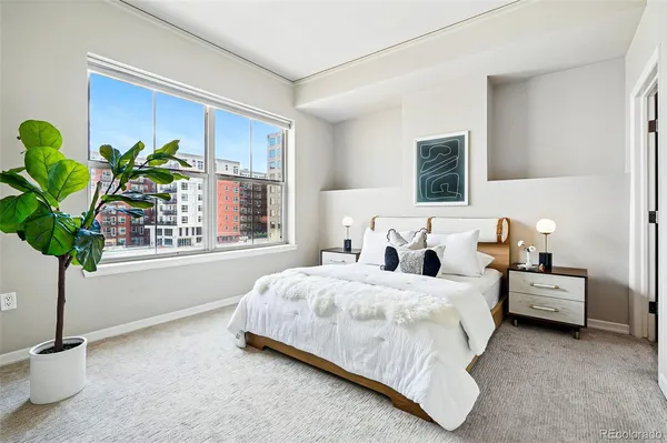 a bedroom with bed and a window