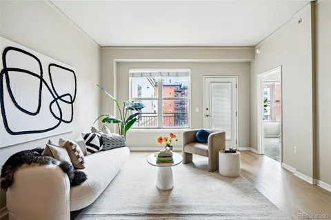 a living room with furniture and entryway