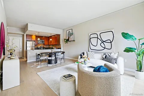 a living room with furniture and white walls