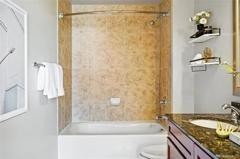a spacious bathroom with a sink double vanity and a mirror