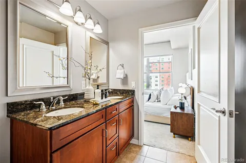 a bench sitting in a living room next to a window